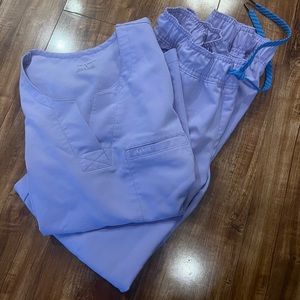 Small Jaanuu Lilac scrubs.